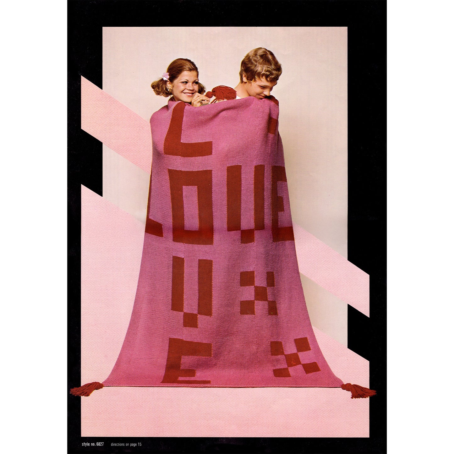 Two people wrapped in a pink blanket with red text "Love" on a plain background