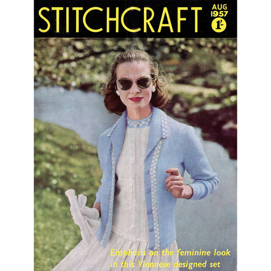Stitchcraft magazine cover, August 1957, featuring a woman wearing a light blue cardigan with white trim and a white dress. The text on the cover reads 'Stitchcraft' and 'Aug 1957.' The text at the bottom of the cover reads 'Emphasis on the feminine look in this Viennese designed set.'