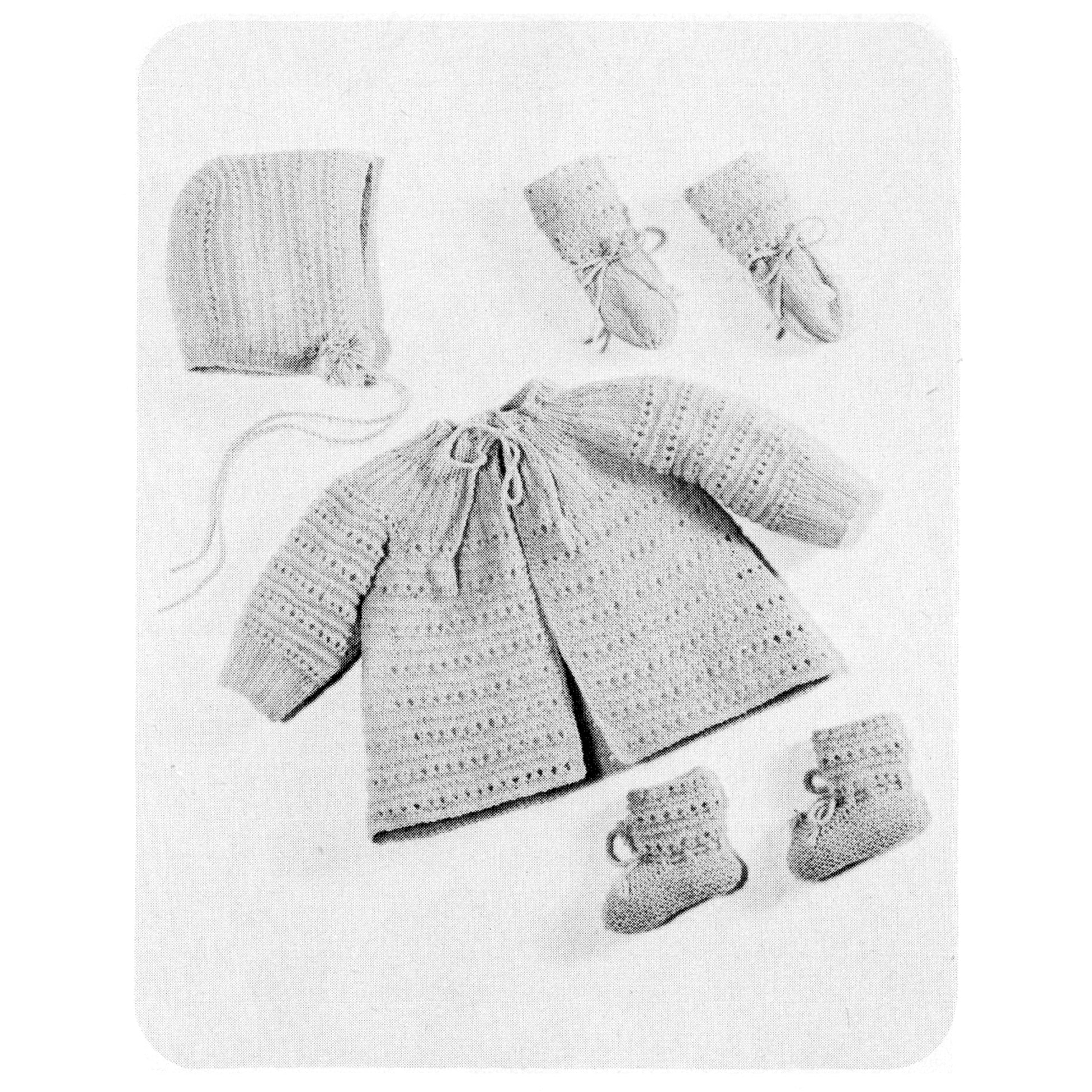 Knitted baby set including a coat, hat, booties, and socks on a white background