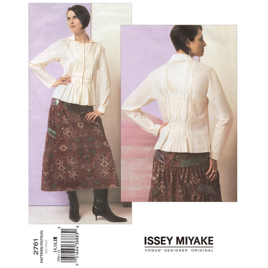 Issey Miyake Vogue sewing pattern 2761 with a model wearing a white blouse and patterned skirt.